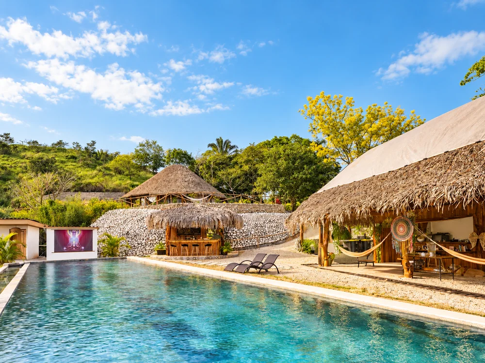 Sunny retreat pool and open-air gathering spaces